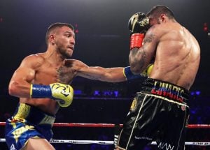 Vasiliy Lomachenko survives knockdown, stops Jorge Linares in 10th to win lightweight championship
