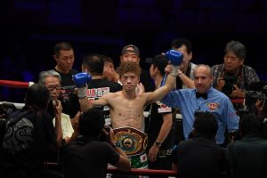 Tanaka retains title in flyweight war with Taguchi