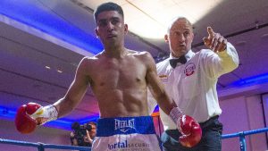 Farooq stops Williams to retain British title