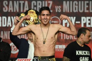 Santa Cruz beats Flores for title in fourth weight class