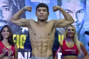 Akhmadaliev takes two belts with split decision win over Roman