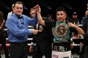 Julio Cesar Martinez decks and stops Joel Cordova, retains WBC flyweight title by sixth-round stoppage