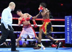 Raymond Ford Rallies, Stops Otabek Kholmatov In 12th Round To Win WBA Title