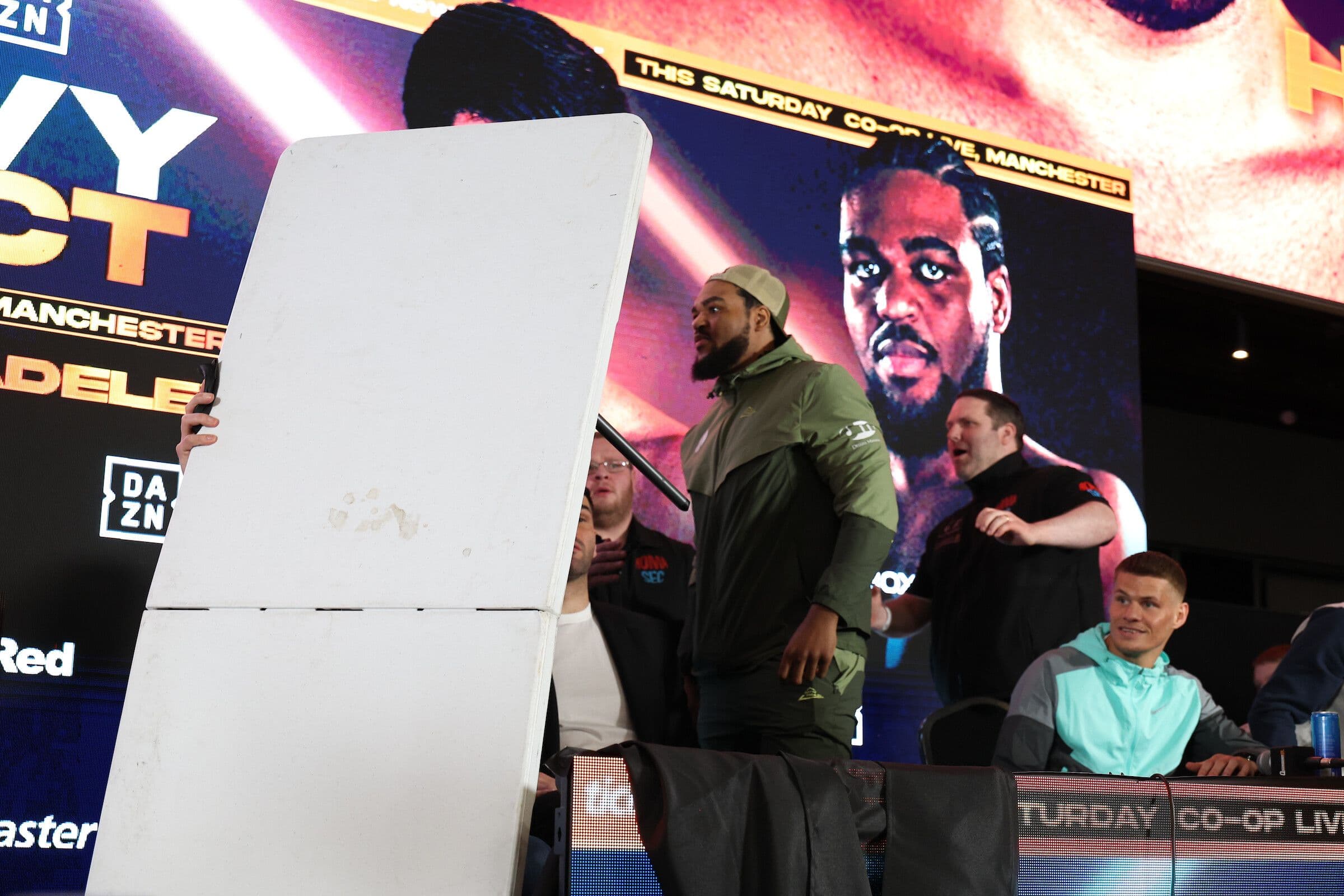 Jeamie TKV Flips Table At Heated Press Conference Ahead Of Adeleye Clash