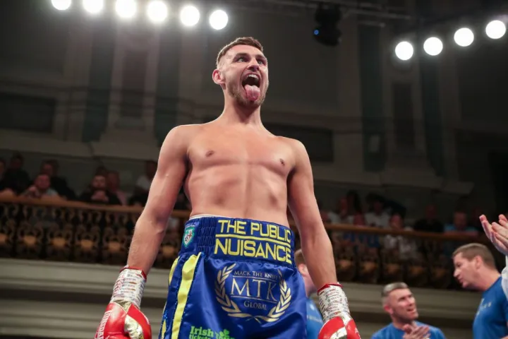 Sean McComb climbs off the canvas to defeat Ben Crocker