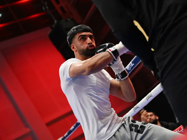 Adam Azim and Kurt Scoby almost come to blows during public workout