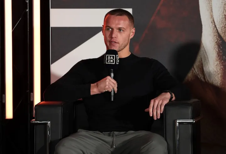 Tony Sims and George Liddard give Jimmy Sains the key to Derrick Osaze