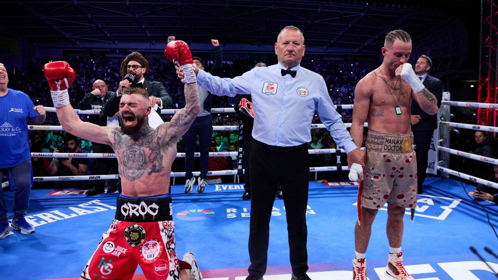 Lewis Crocker celebrates as the decision of his fight versus Paddy Donovan for the IBF World Welterweight title is announced.