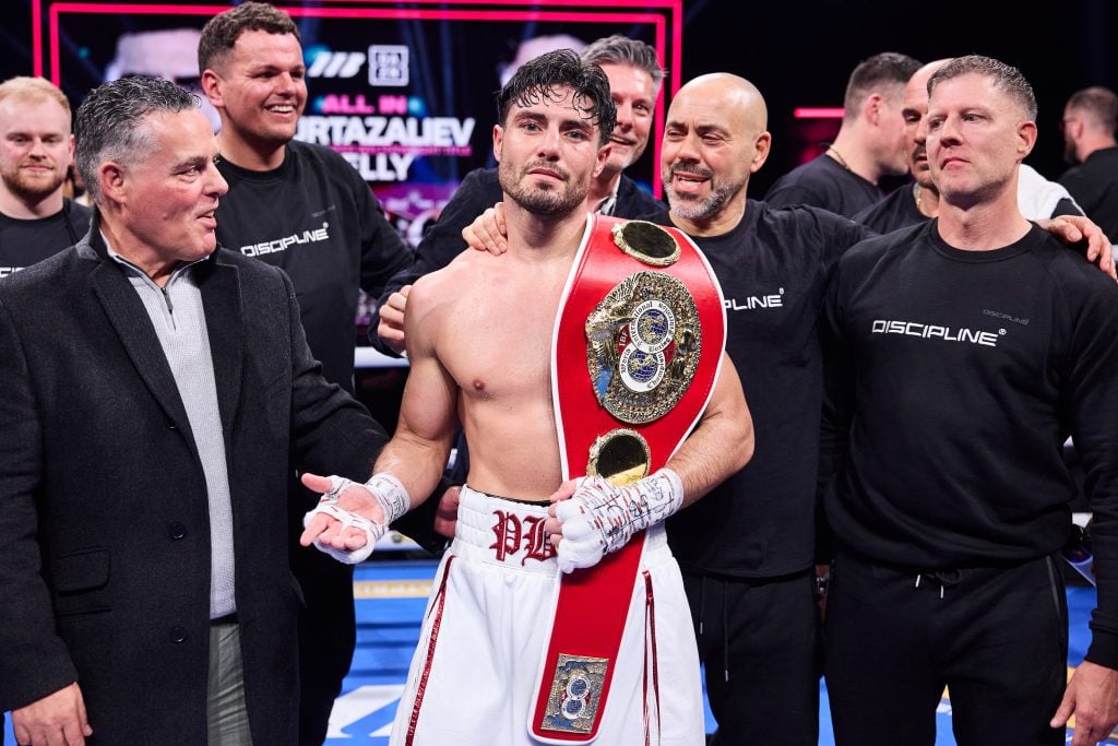 Josh Kelly celebrates with his team and family after winning the IBF World Super Welterweight title against Bakhram Murtazaliev.