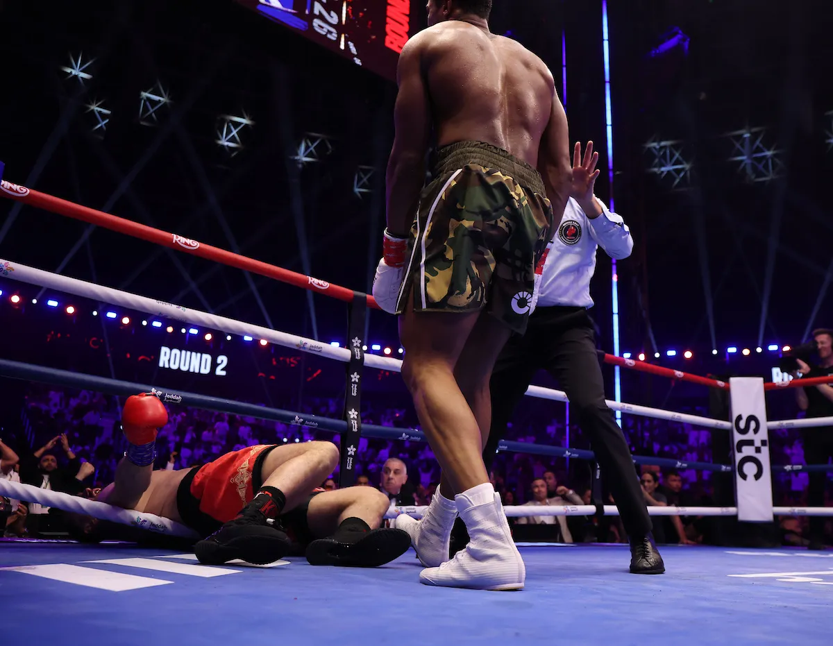 Anthony Joshua survives two Kristian Prenga knockdowns to keep Tyson Fury fight alive