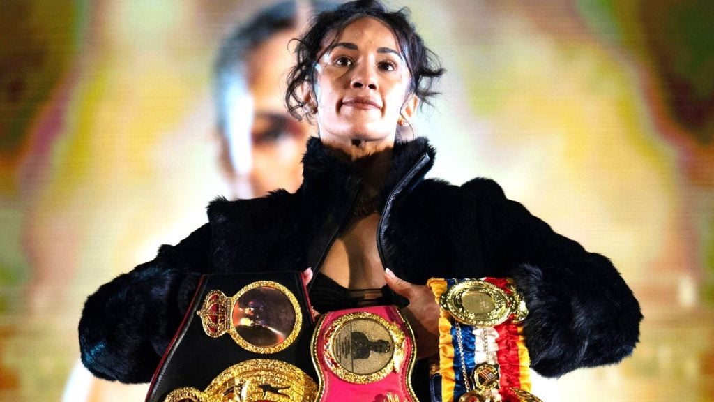 Amanda Serrano holds her Ring and her world championship belts at the MVPW launch press conference