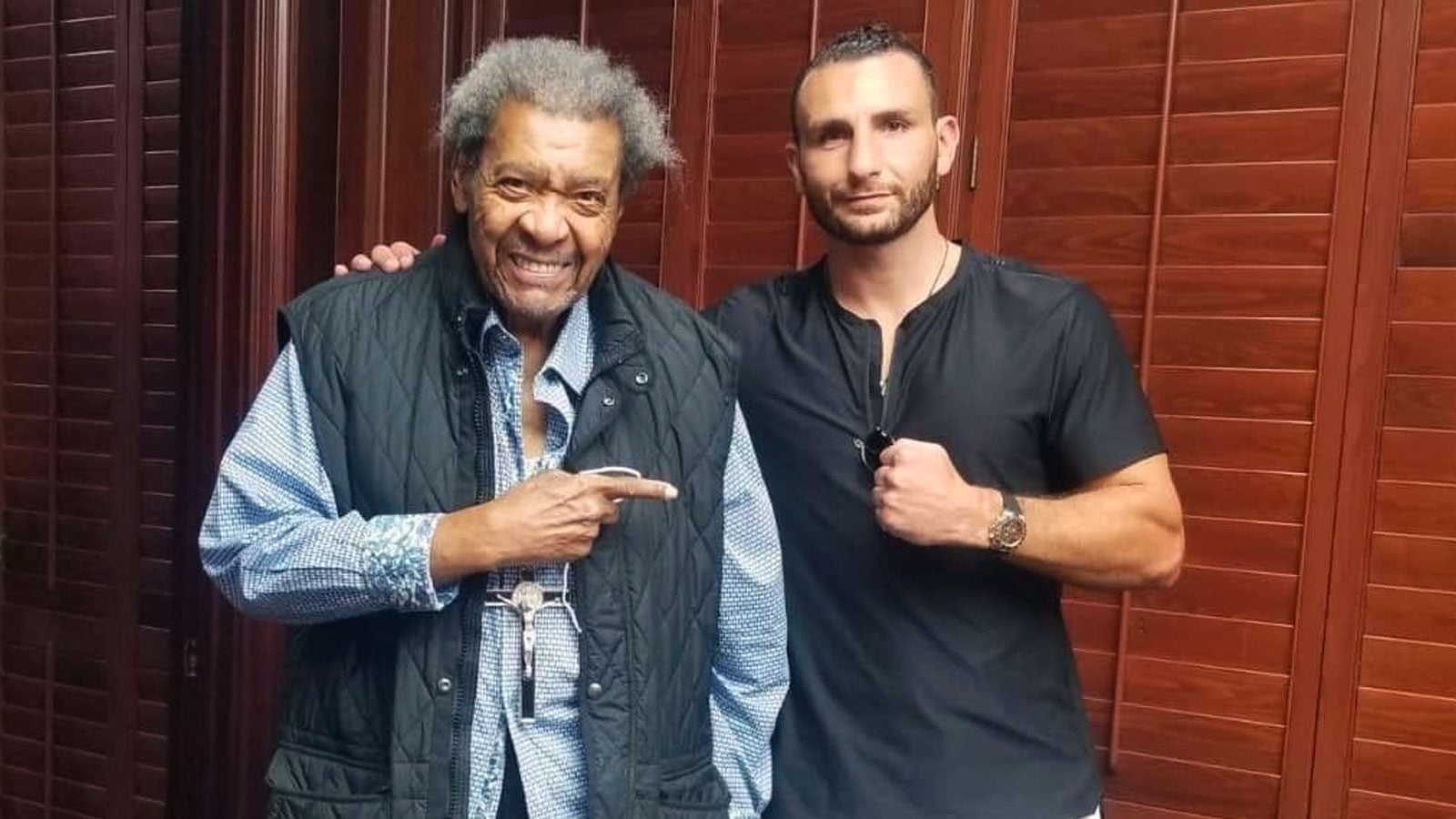 Don King and Noel Mikaelyan pose together after Mikaelyan signs a contract with King's promotional firm.