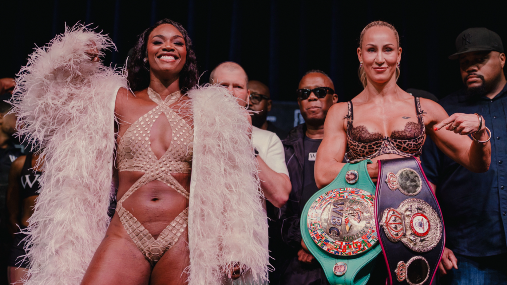 Claressa Shields and Kaye Scott pose at the weigh-in for their middleweight world title fight.