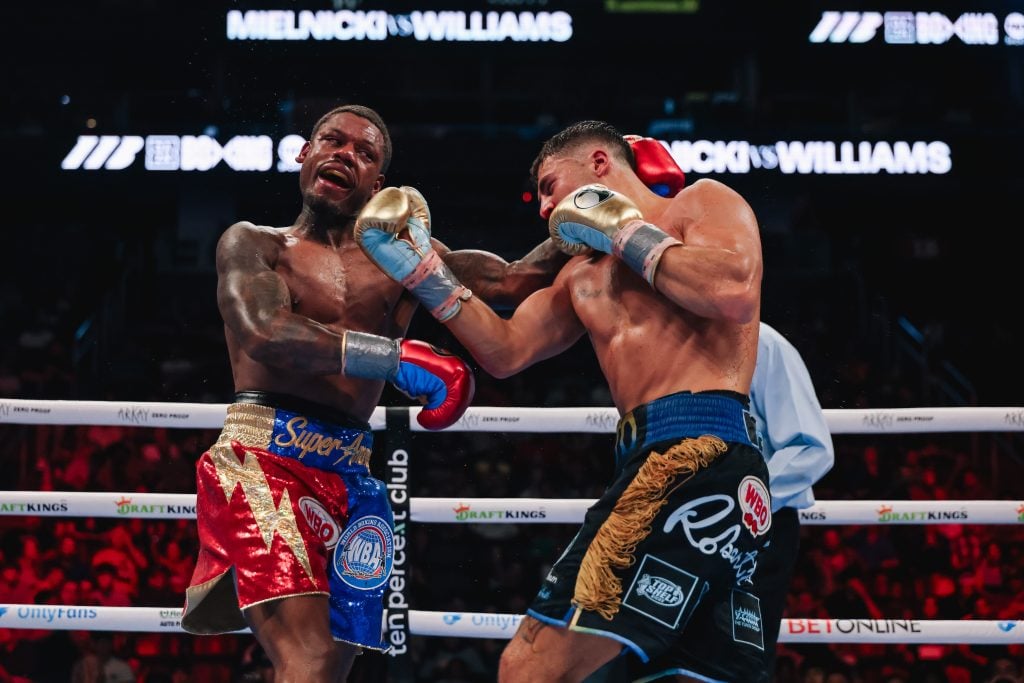 Vito Mielnicki Jr. lands an undercut on Austin Williams during their middleweight contest.