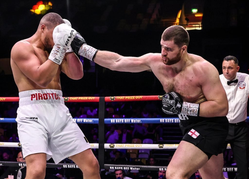 Johnny Fisher connects with a right hand on Michael Pirotton during their bout.
