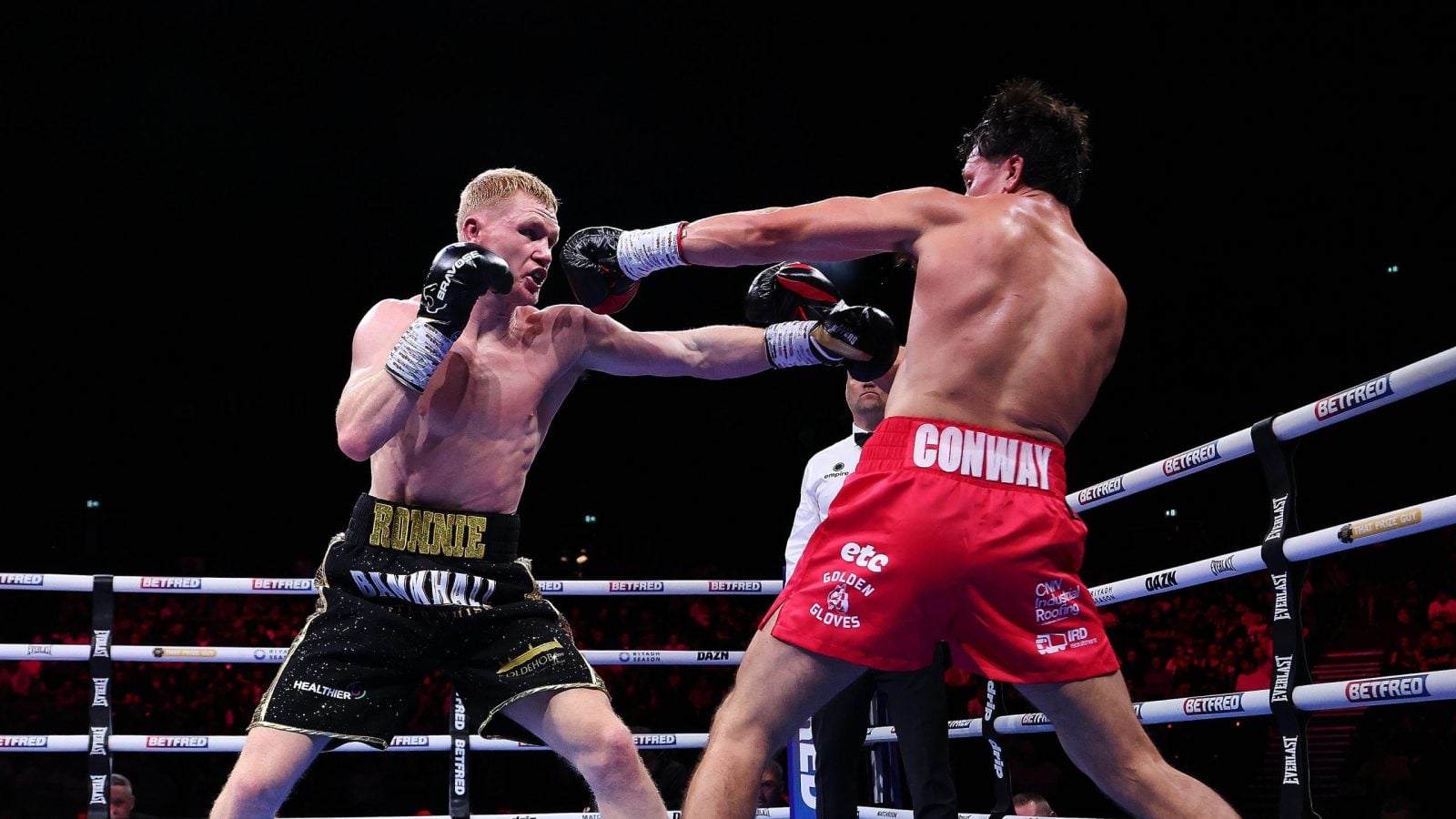 Mark Jeffers and Kieron Conway exchange punches during their super-middleweight contest.
